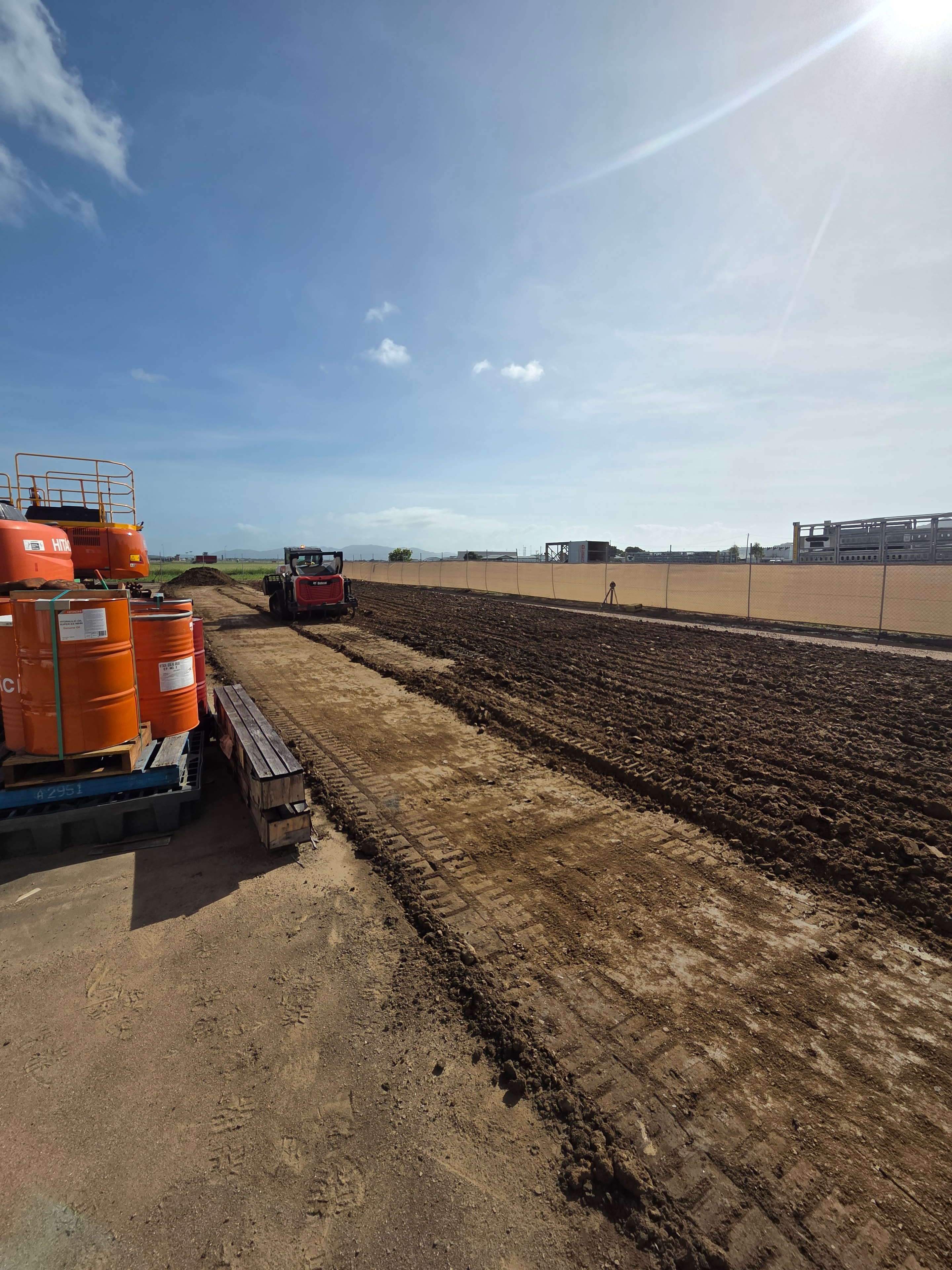 Service yard re-levelling — wide view of re-graded commercial yard