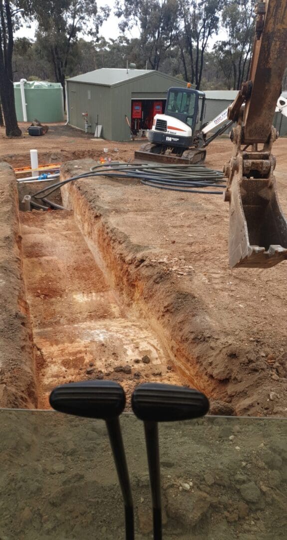 Excavated trench at rural property