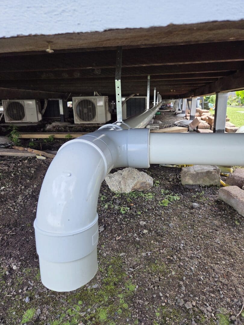 PVC pipe installation on gravel site