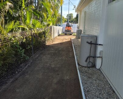 Newly paved driveway alongside residential property
